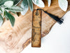 a piece of wood with a tassel on top of it