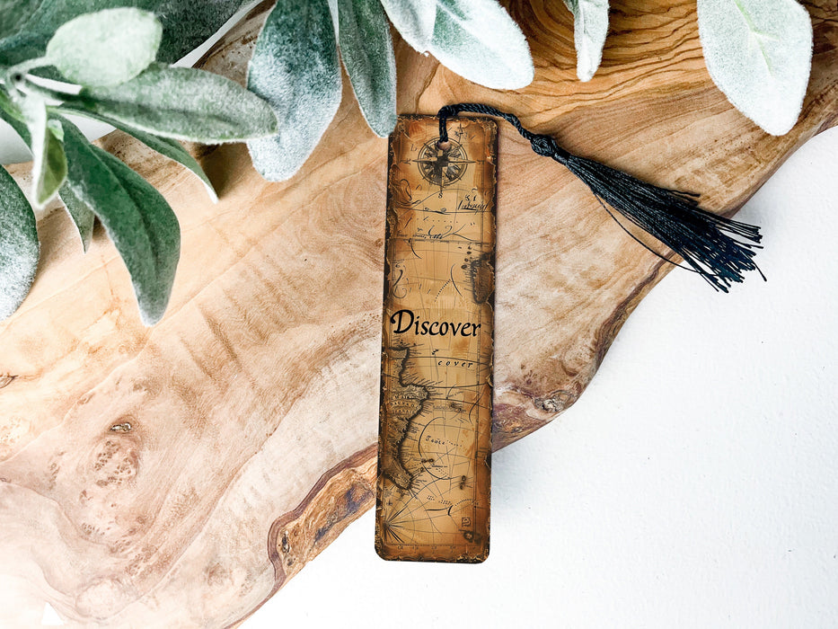 a piece of wood with a tassel on top of it