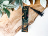 a bookmark with a picture of planets on it
