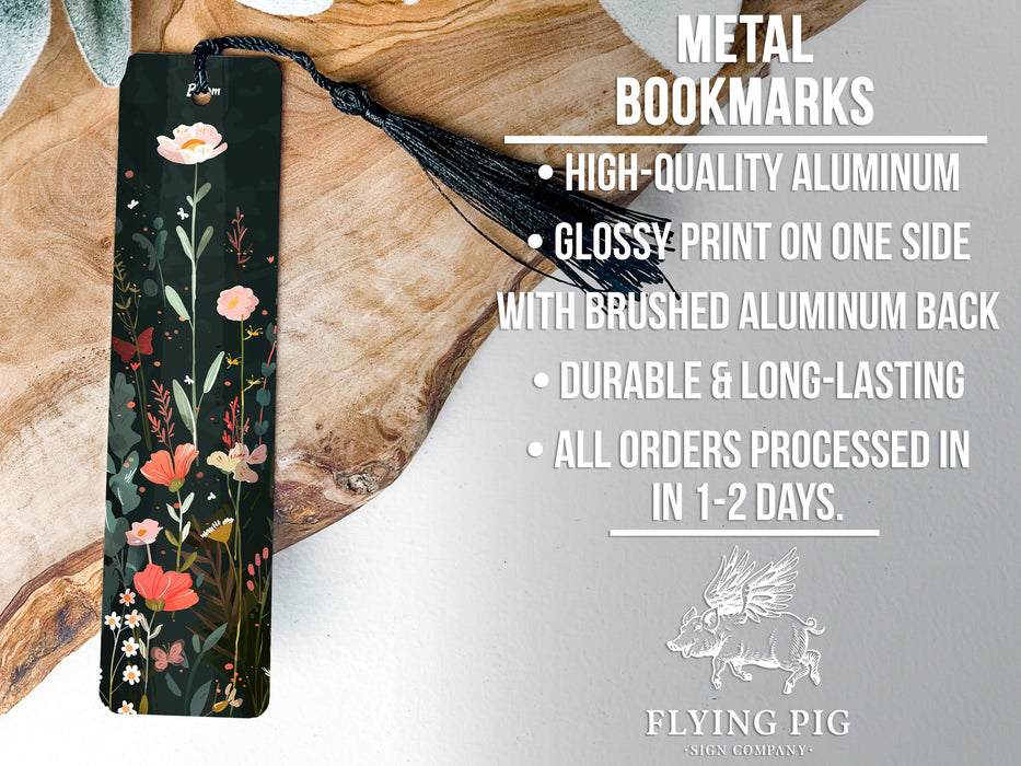 a metal bookmark with a floral design on it