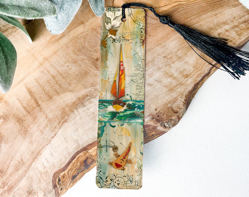 a bookmark with a picture of a sailboat on it