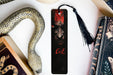 a bookmark with a picture of a demon on it