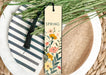 a bookmark with a floral design on it