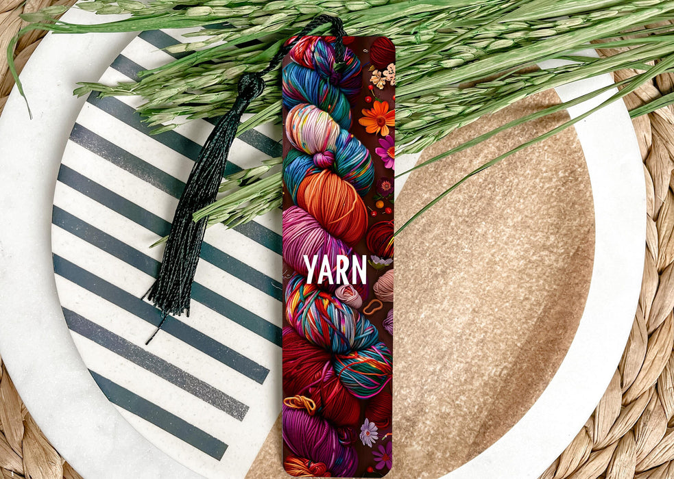 a yarn bookmark sitting on top of a plate