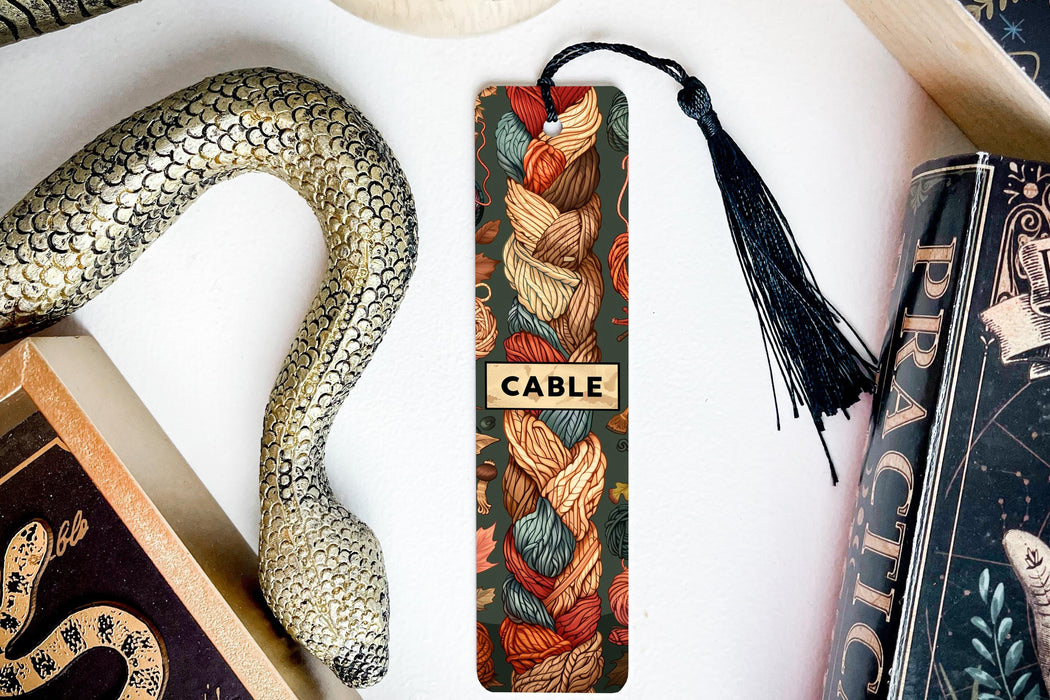 a table topped with books and a snake