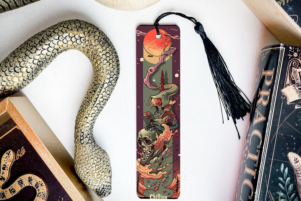 a bookmark with a dragon and a snake on it