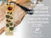 a metal bookmark with a sunflower on it