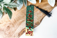 a bookmark with a picture of a christmas tree on it