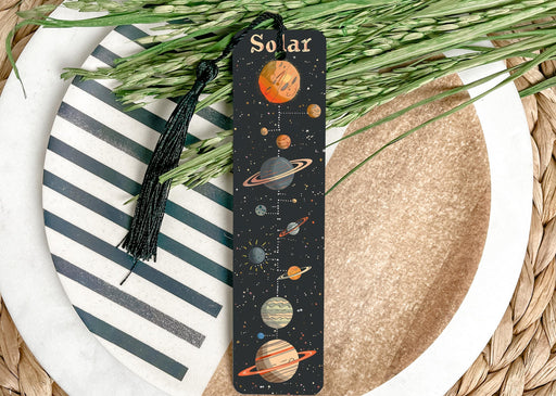 a bookmark with a picture of the solar system on it