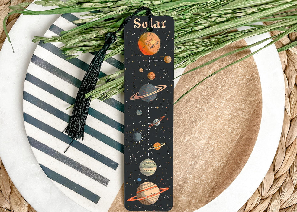 a bookmark with a picture of the solar system on it