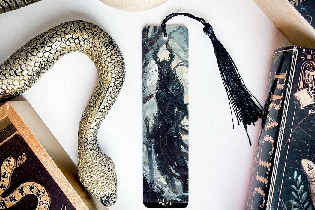 a bookmark, snake, and other items on a table