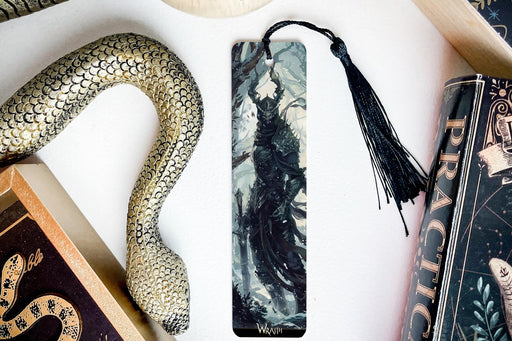 a bookmark, snake, and other items on a table