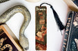 a bookmark with a picture of a woman and a snake on it