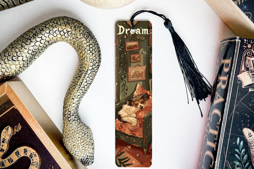 a bookmark with a picture of a woman and a snake on it