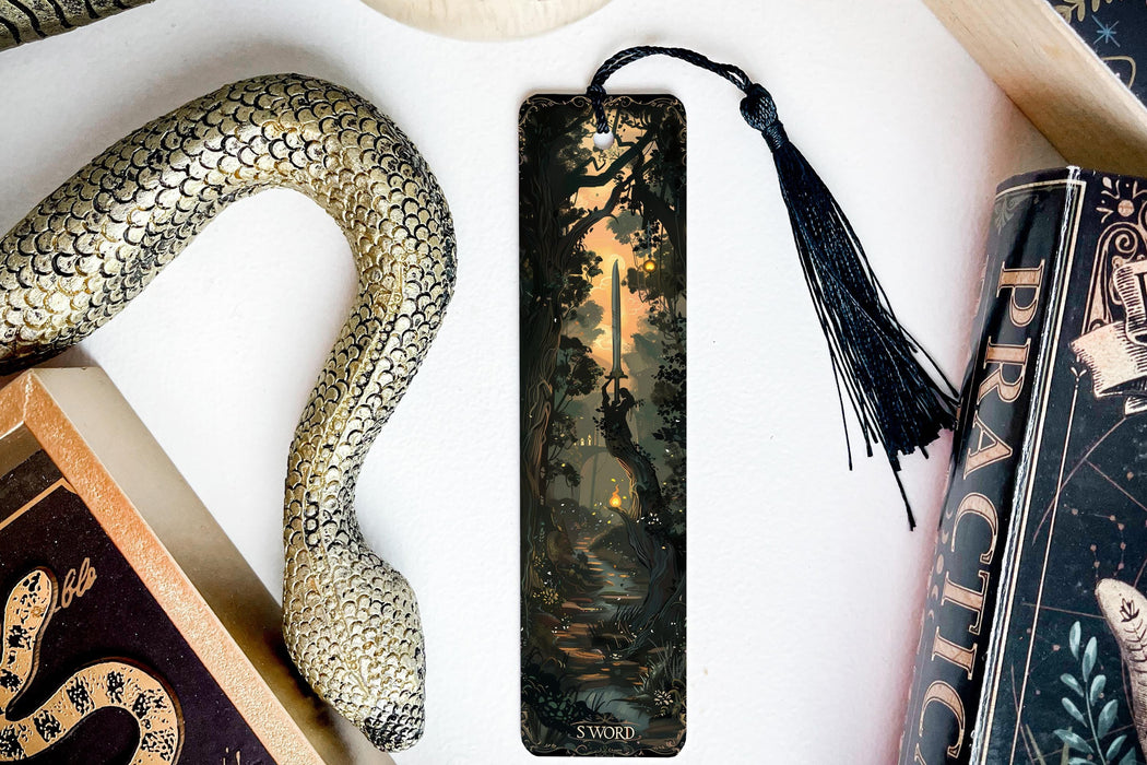 a bookmark with a picture of a forest on it