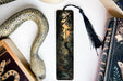 a bookmark with a picture of a forest on it