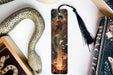 a bookmark with a picture of a woman and a snake on it