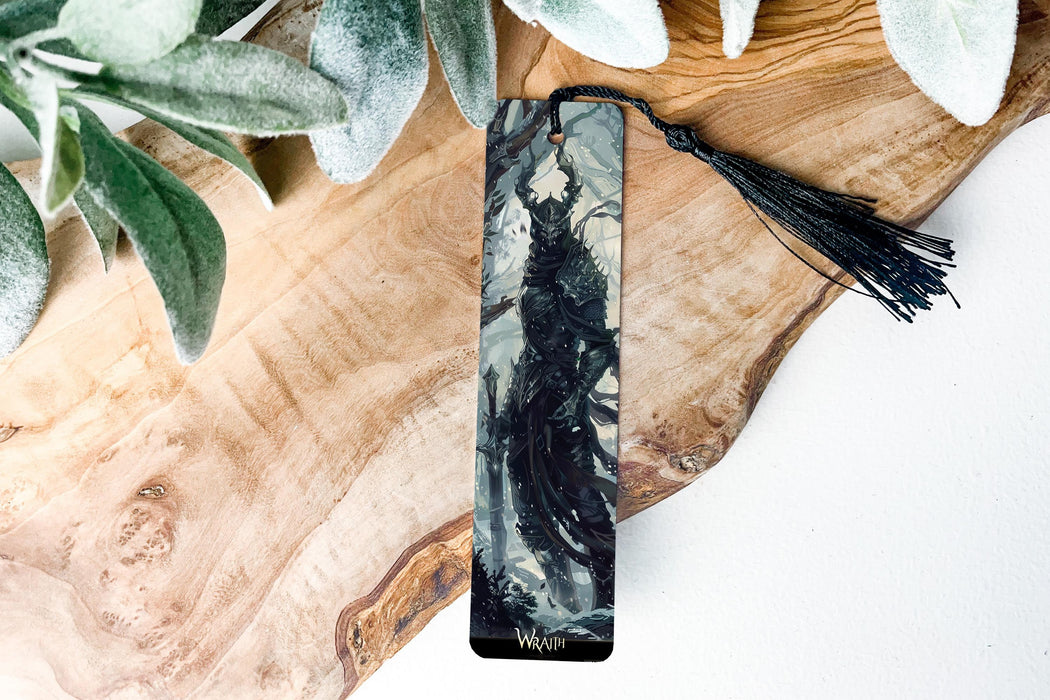 a black and white bookmark sitting on top of a wooden table