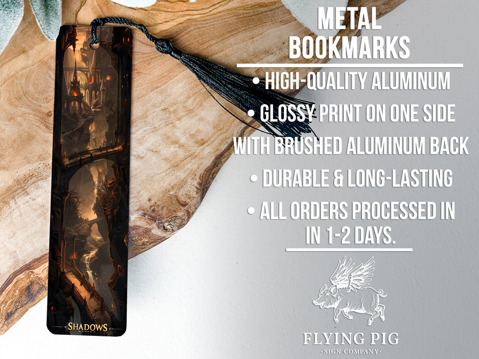 a metal bookmark with a tassel hanging from it