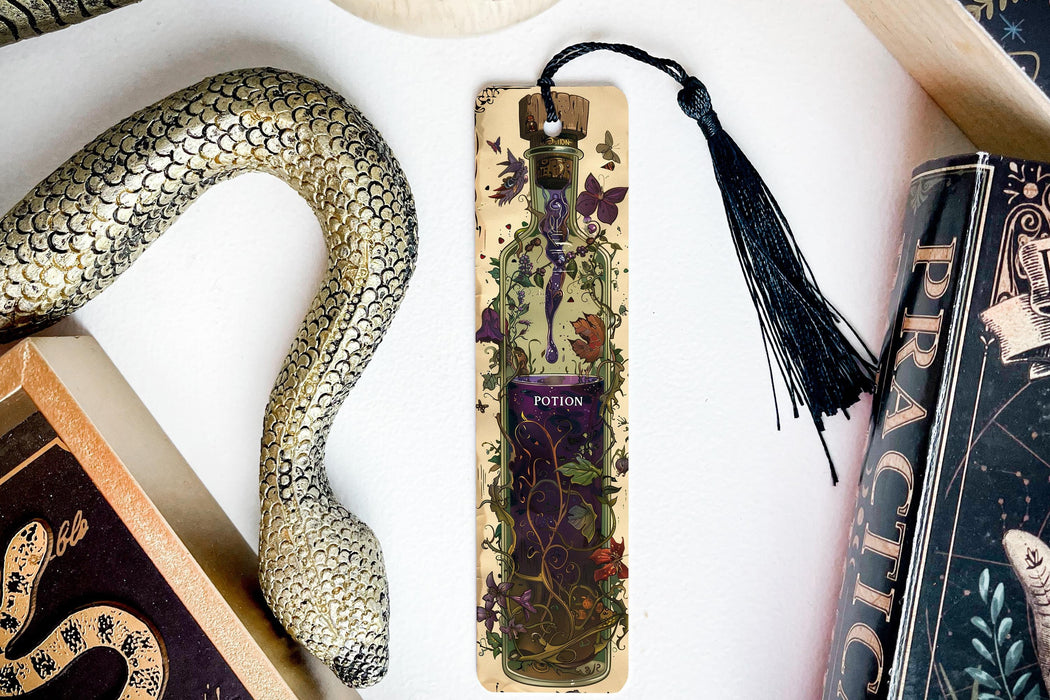 a snake, a bookmark, and other items on a table