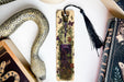 a snake, a bookmark, and other items on a table