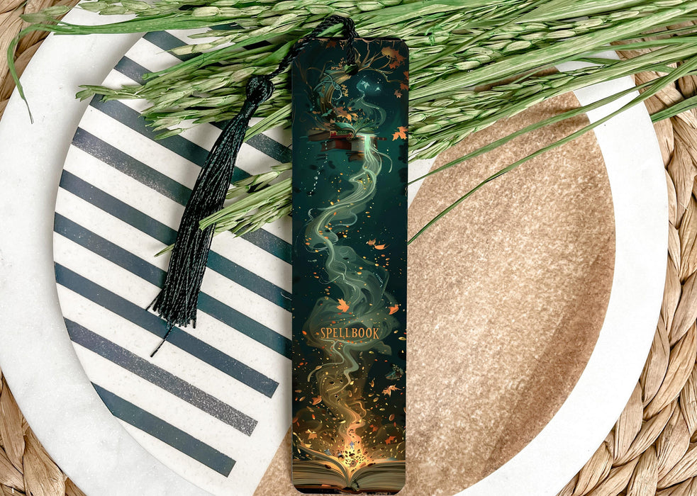 a green bookmark sitting on top of a white plate