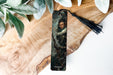 a bookmark with a picture of a man on it