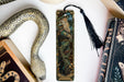 a bookmark, snake, and other items on a table