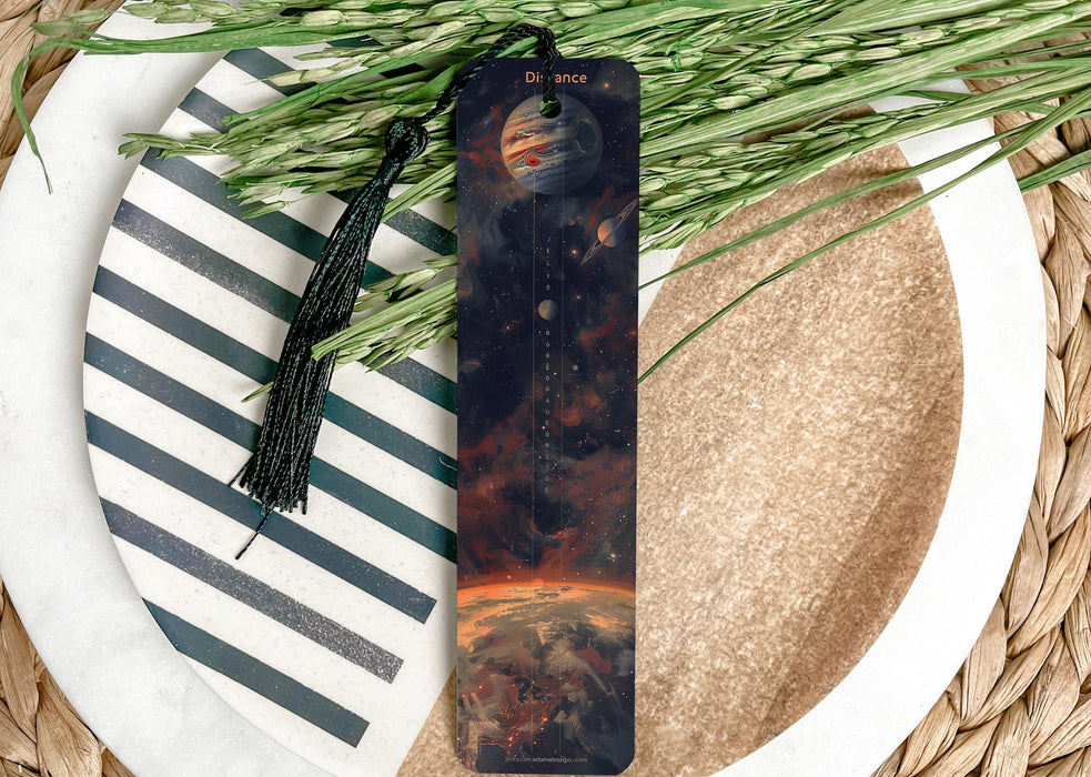 a bookmark on a plate next to a plant