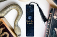 a bookmark with the words reach for the moon on it