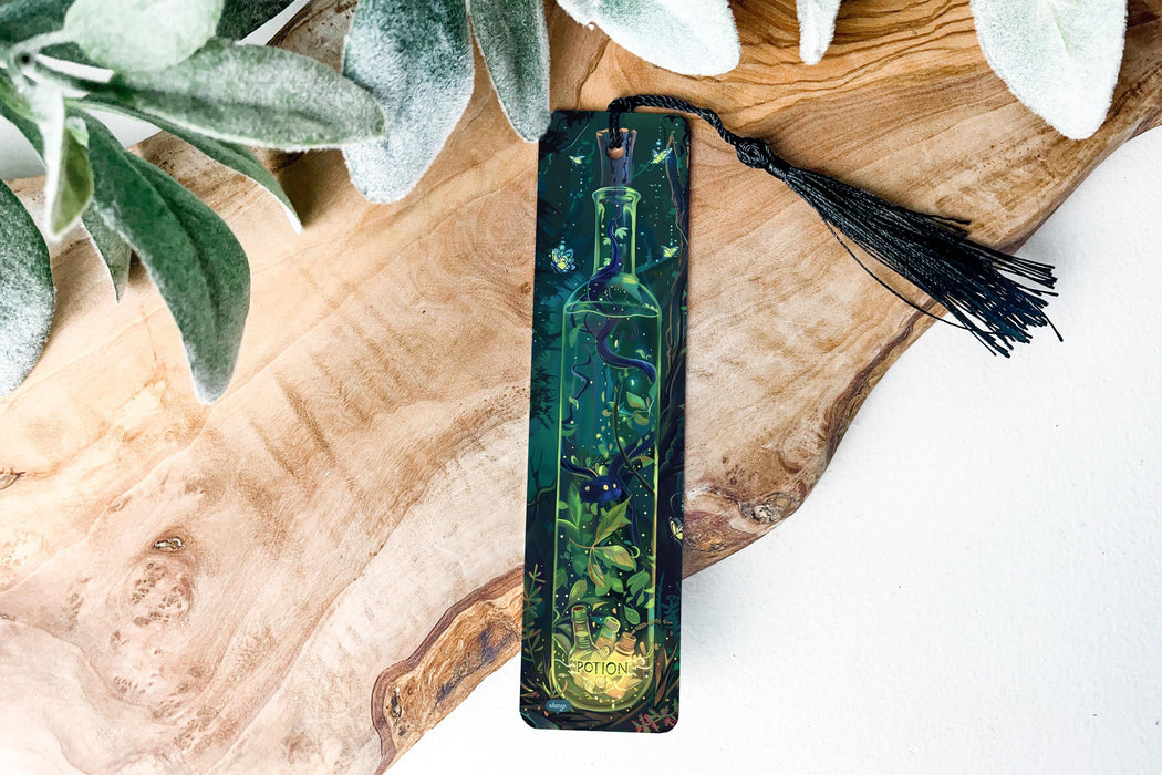 a bookmark with a picture of a forest on it
