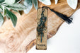 a bookmark with a picture of a warrior on it