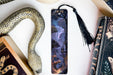a bookmark with a picture of a forest on it