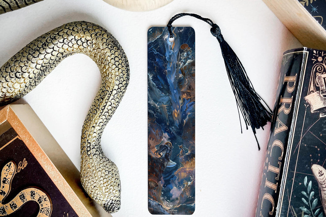 a bookmark, snake, and other items on a table