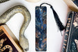 a bookmark, snake, and other items on a table