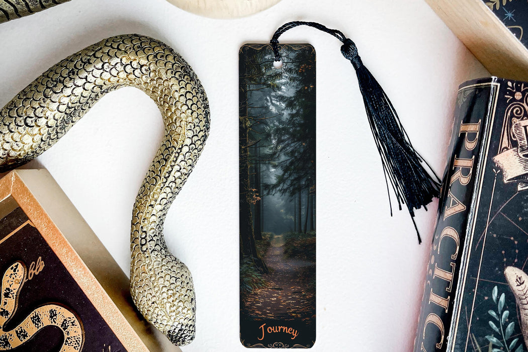 a bookmark with a picture of a path in the woods
