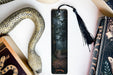 a bookmark with a picture of a path in the woods