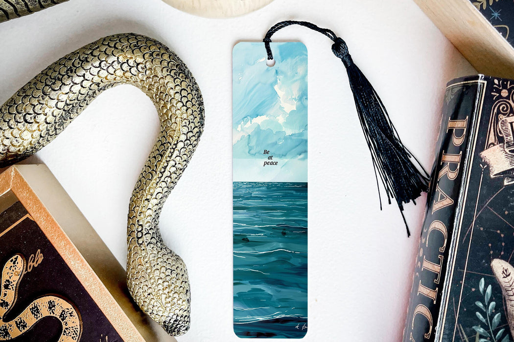 a bookmark with a picture of a sea and a snake on it