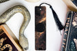 a bookmark, snake, and other items on a table