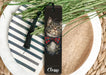 a bookmark with a picture of a cat wearing a bow tie