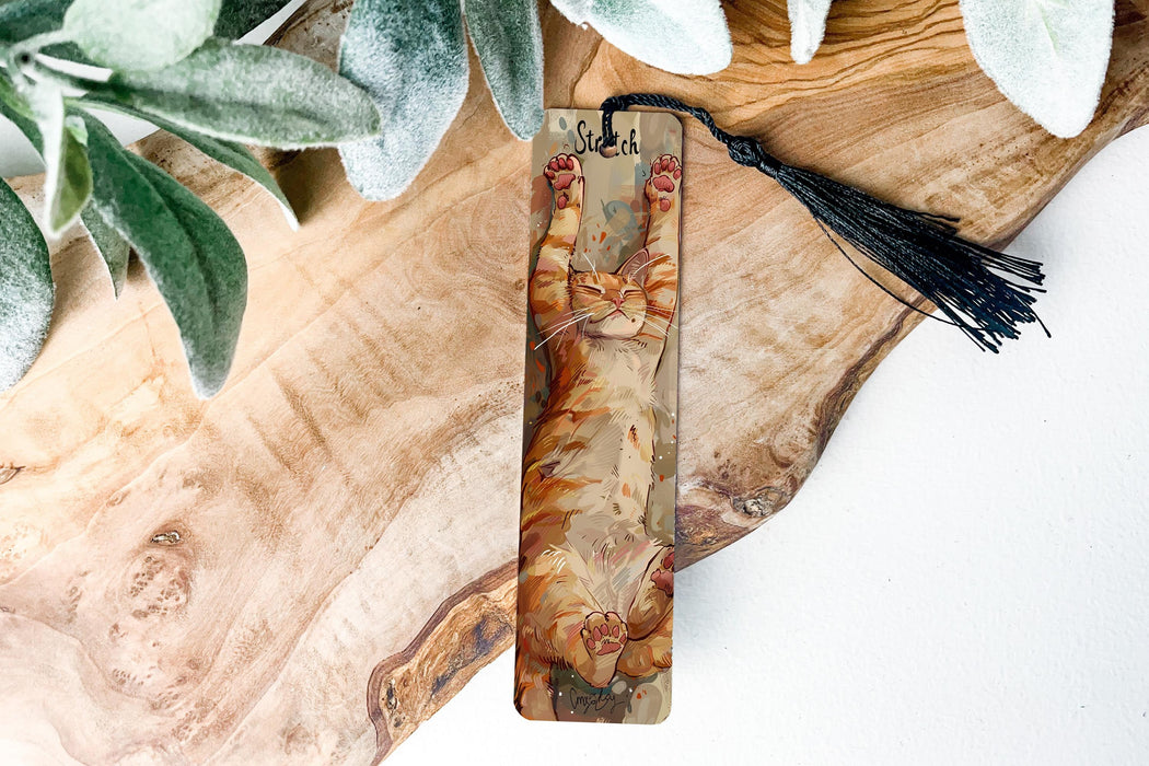 a piece of wood with a tassel on top of it