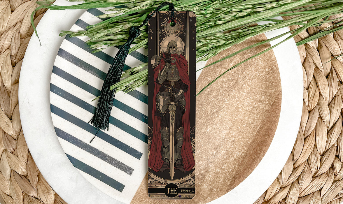 a cross on a plate next to some grass