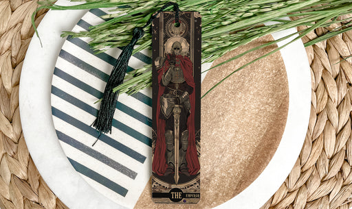 a cross on a plate next to some grass