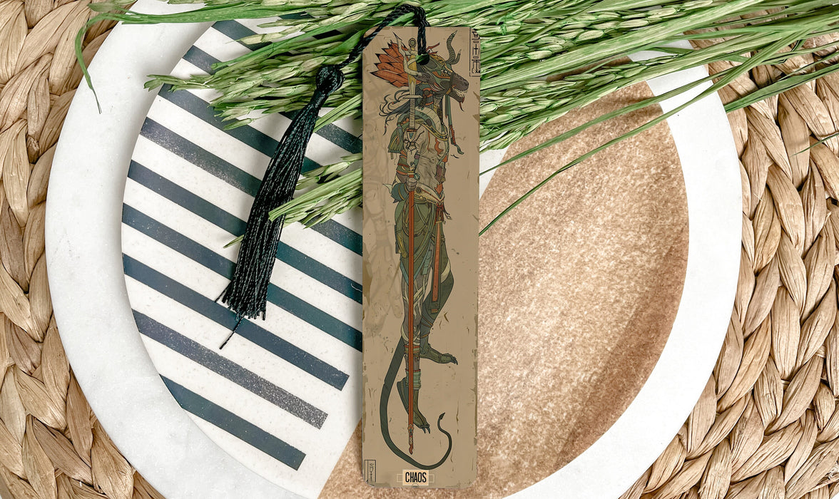 a plate with a bookmark and a plant on it