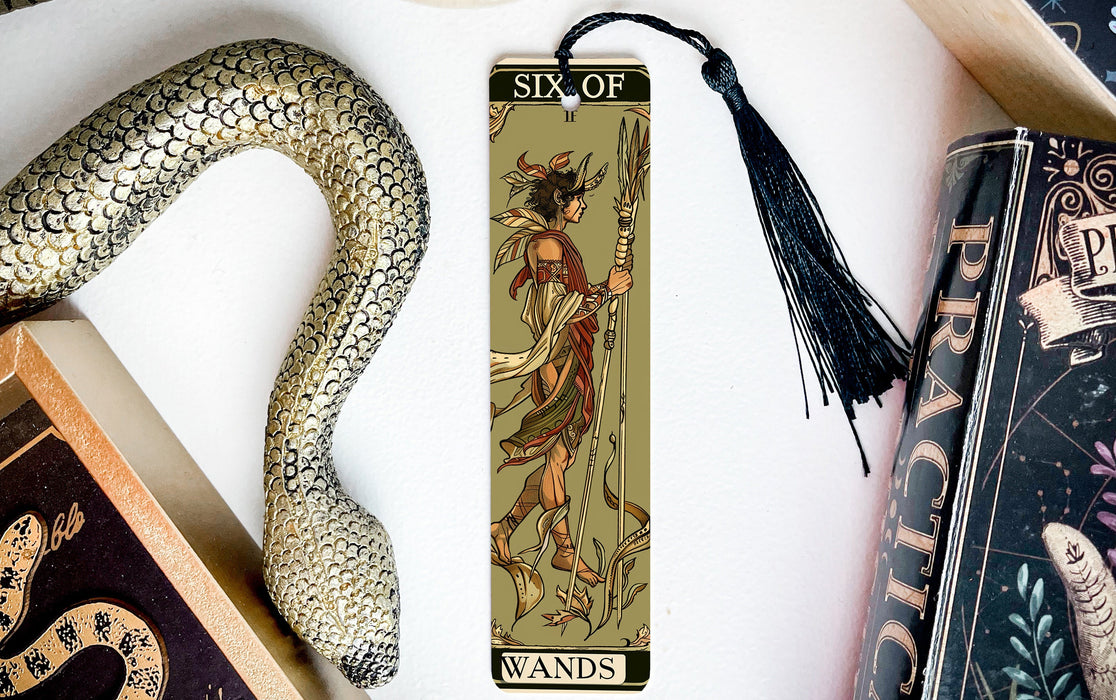 a bookmark with a picture of a demon on it