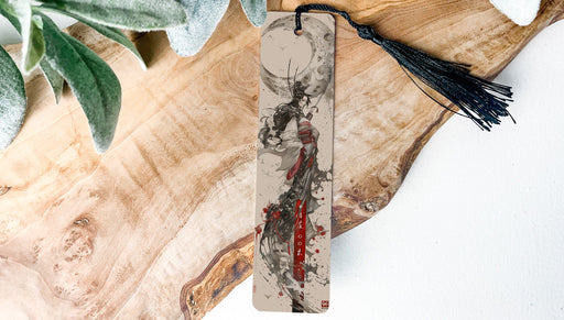 a piece of wood with a tassel hanging from it