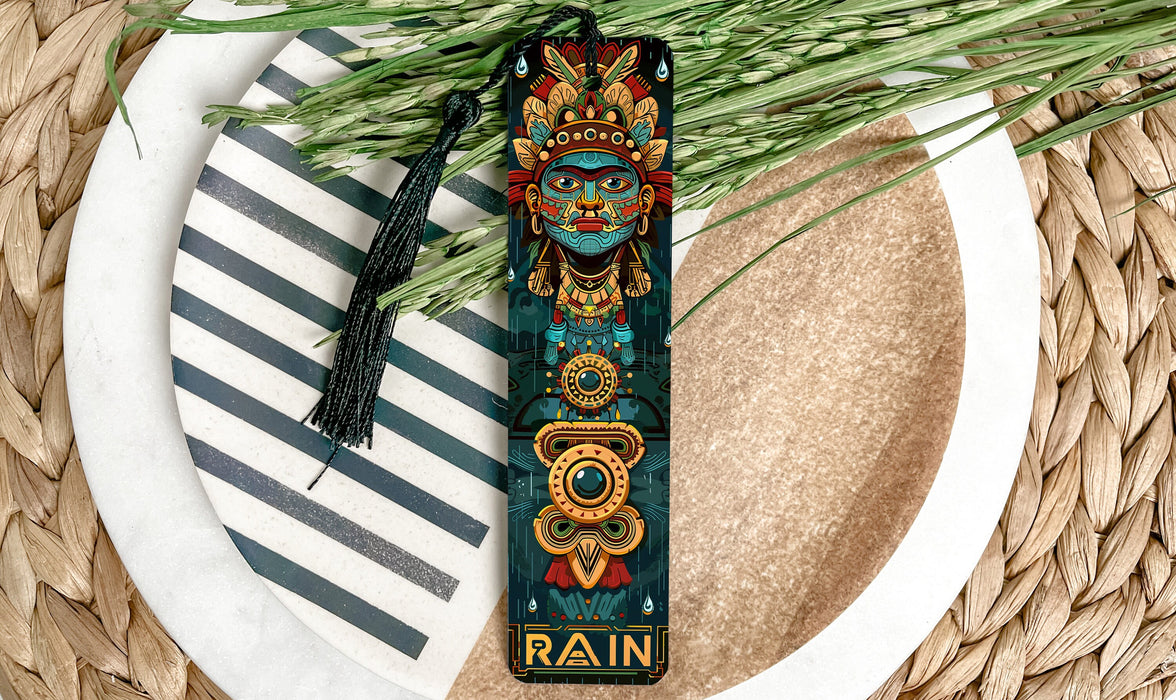 a bookmark with a tassel on top of a plate