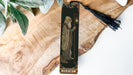 a bookmark with a picture of a man holding a cross