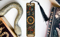 a snake, a bookmark, and some books on a table