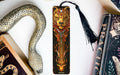 a bookmark with a dragon and a snake on it